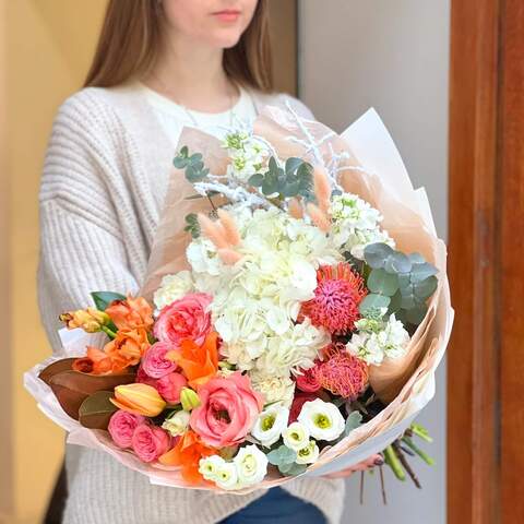 Photo of Bright and delicate bouquet with lilies, leucospermums, eustomas «Peaches in the snow»