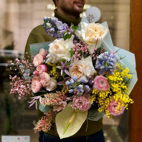 Bright fragrant bouquet with peony roses, ranunculi and mimosa «Spring days», Flowers: Pion-shaped rose, Ranunculus, Mimosa, Genista, Anthurium, Delphinium, Clematis, Grevillea