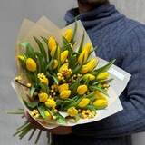 Photo of Bright bouquet with tulips and ilex «Sunny Katrusya»