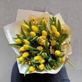 Photo of Bright bouquet with tulips and ilex «Sunny Katrusya»