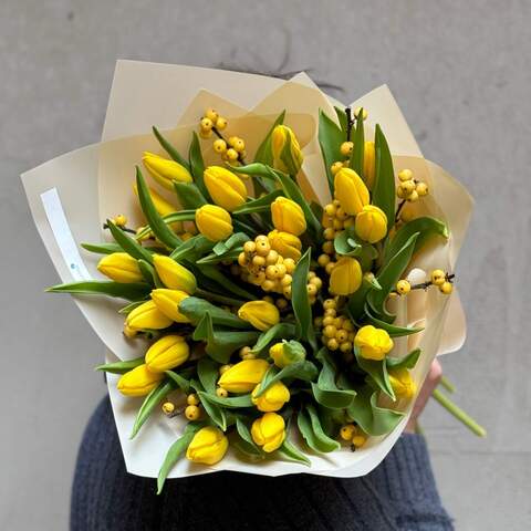 Photo of Bright bouquet with tulips and ilex «Sunny Katrusya»