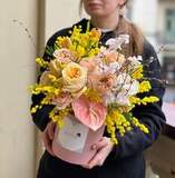 Photo of Colorful composition in a box with ranunculus and peony roses «Sunny Cupid»