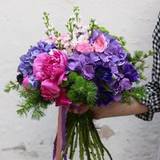 Photo of Bright gift bouquet with hydrangeas and garden roses