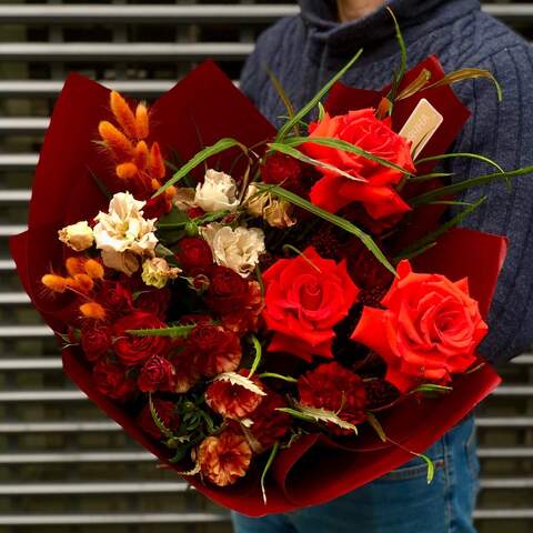 Photo of Bright bouquet with red roses, interesting ranunculus and eustoma «Fiery fox»