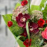 Photo of Rich red and green bouquet «Velvet butterfly»