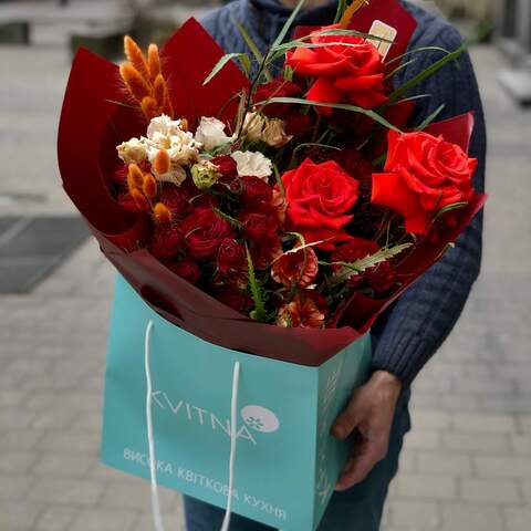 Photo of Bright bouquet with red roses, interesting ranunculus and eustoma «Fiery fox»