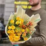 Photo of Bright yellow bouquet of spray peony roses and ilex «Sunny berries»