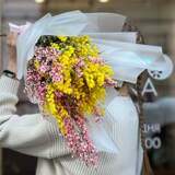 Photo of Cute fragrant bouquet of mimosa and genista «First Warmth»