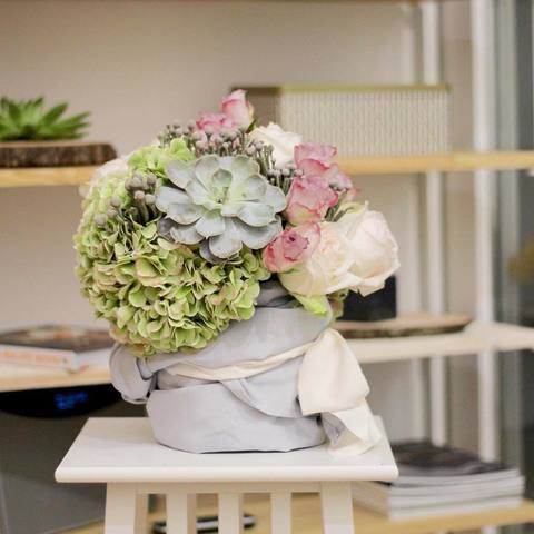 Interior composition from autumn hydrangeas, fragrant roses O'Hara and magic succulent, Composition with green hydrangea