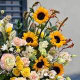 Photo of Basket with flowers «Sunny garden»