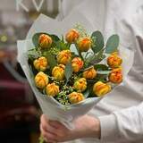Photo of 15 orange tulips with eucalyptus in a bouquet «Fiery salsa»