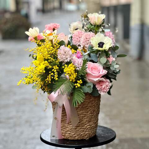 Delicate fragrant composition in a basket «Spring melody», Flowers: Mimosa, Hyacinthus, Narcissus, Pion-shaped rose, Anemone, Dianthus, Genista, Eucalyptus