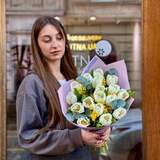 Photo of 17 white tulips and mimosa in a bouquet «Gentle Rays»