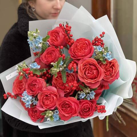 Photo of Bright and contrasting bouquet of peony roses, ilex and oxypetalum «Fire and Ice»