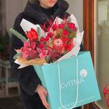 Photo of Red exotic bouquet with banksia and cymbidium «Winter coral»