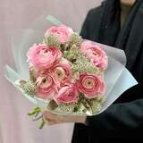 Photo of Delicate pink bouquet of 7 ranunculi and skimmia