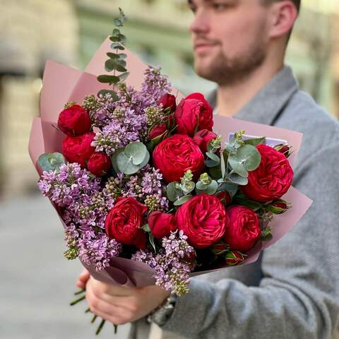 Photo of Interesting bouquet with Red Piano roses and lilacs «Evening Charms»