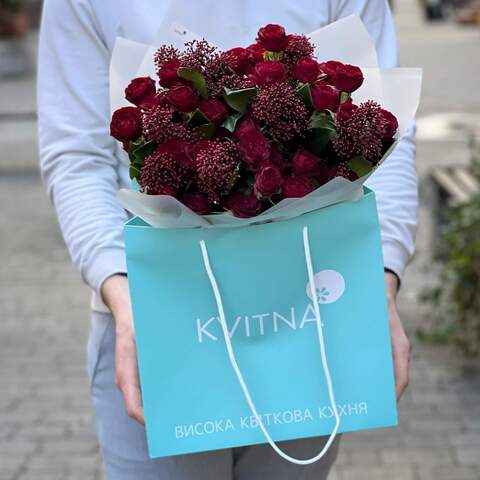 Photo of Bright red bouquet of spray roses and skimmia «Passion of Anastasia»