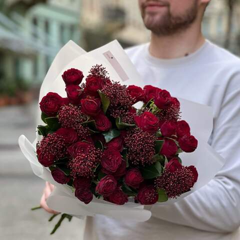 Photo of Bright red bouquet of spray roses and skimmia «Passion of Anastasia»