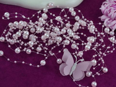 Намистини на волосіні рожеві