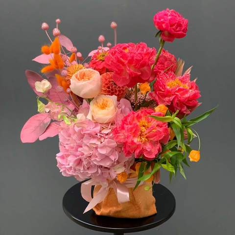 Photo of Flower arrangement in the fabric «Blooming coral»