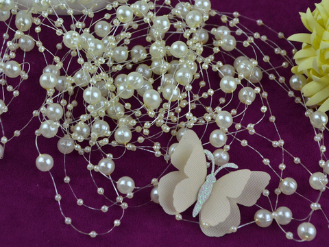 Намистини на волосіні кремові