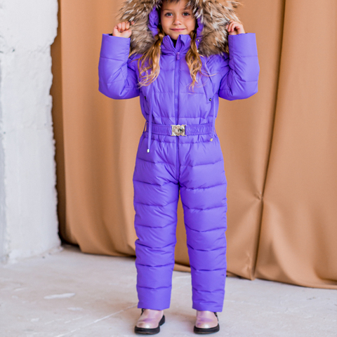 Дитячий зимовий комбінезон фіолетового кольору і опушкою з натурального хутра