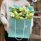 Photo of Spring bouquet of variegated tulips, viburnum and oxypetalum «Green wave»
