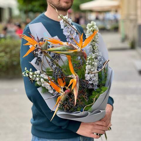 Exotic bouquet with strelitzia and viburnum «Tropical colors», Flowers: Asparagus, Delphinium, Viburnum (berries), Strelitzia, Salex