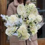 Photo of Bouquet in pure white colors with exotic anthurium and spring flowers «Wings of Love»