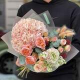 Photo of Cozy bouquet with soft peach hydrangea and delicate ranunculus «Warm Spring»