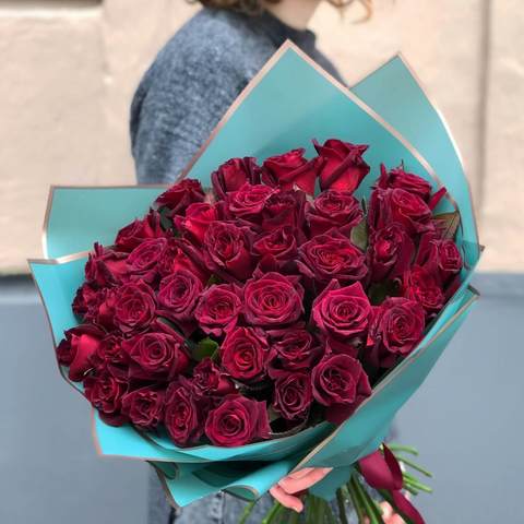 Rose «Black Baccara», Black Baccara — almost black rose bred in France.The bouquet in the photo contains 39 maroon roses.