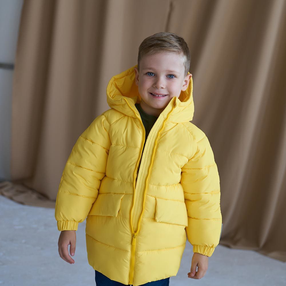 Дитяча подовжена зимова куртка в жовтому кольорі для хлопчика