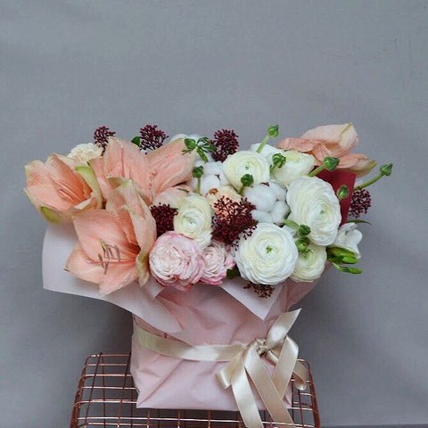 Cozy winter composition of flowers and cotton, Winter floral composition of white Ranunculus