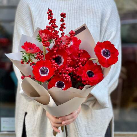 Photo of Bright bouquet of red anemones and ilex «Passionate kiss»