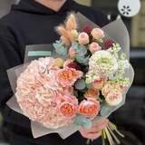 Photo of Cozy bouquet with soft peach hydrangea and delicate ranunculus «Warm Spring»