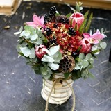 Photo of Composition of flowers for the congratulation of her husband