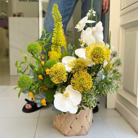 Basket with flowers «Sunny Honey», Flowers: Leucospermum, Dianthus, Sandersonia, Pittosporum, Phalaenopsis, Nigella, Eucalyptus