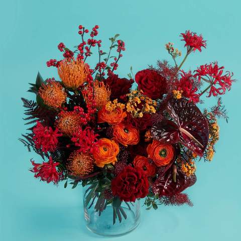 Bouquet «Fiery flowers», Flowers: Ranunculus, Leucospermum, Merine, Rose, Anthurium, Skimmia, Ilex, Ledervaren