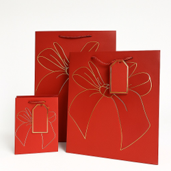 Набор подарочных пакетов с золотым бантом — 3 штуки